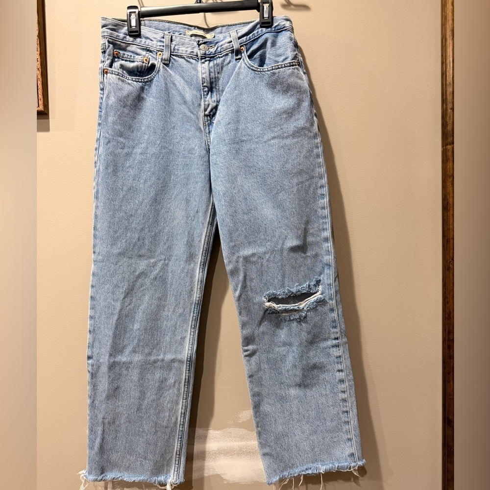 Levi's Light Blue Straight Leg Jeans with Distressed Detail